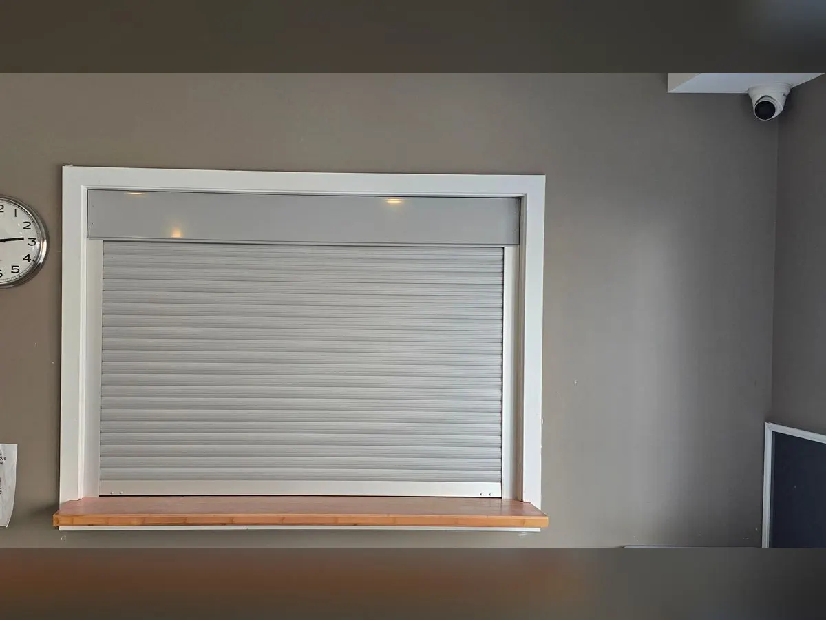 Reception window with a shutter