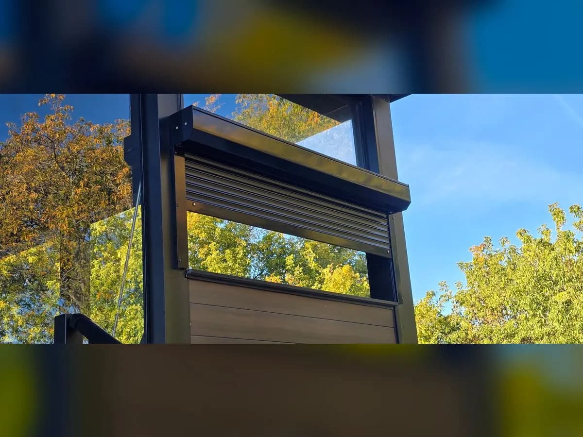 Black shutter on a modern balcony