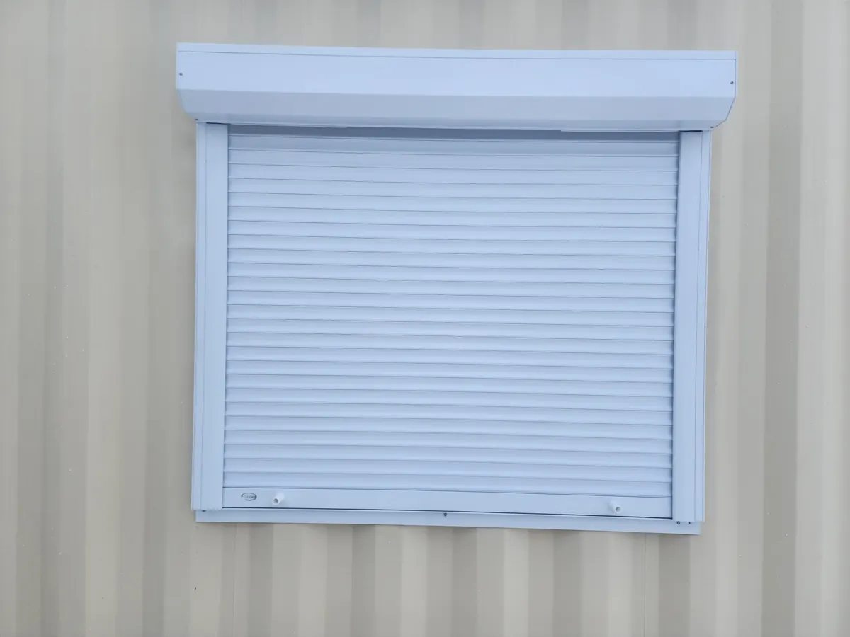 White shutter on a converted container window