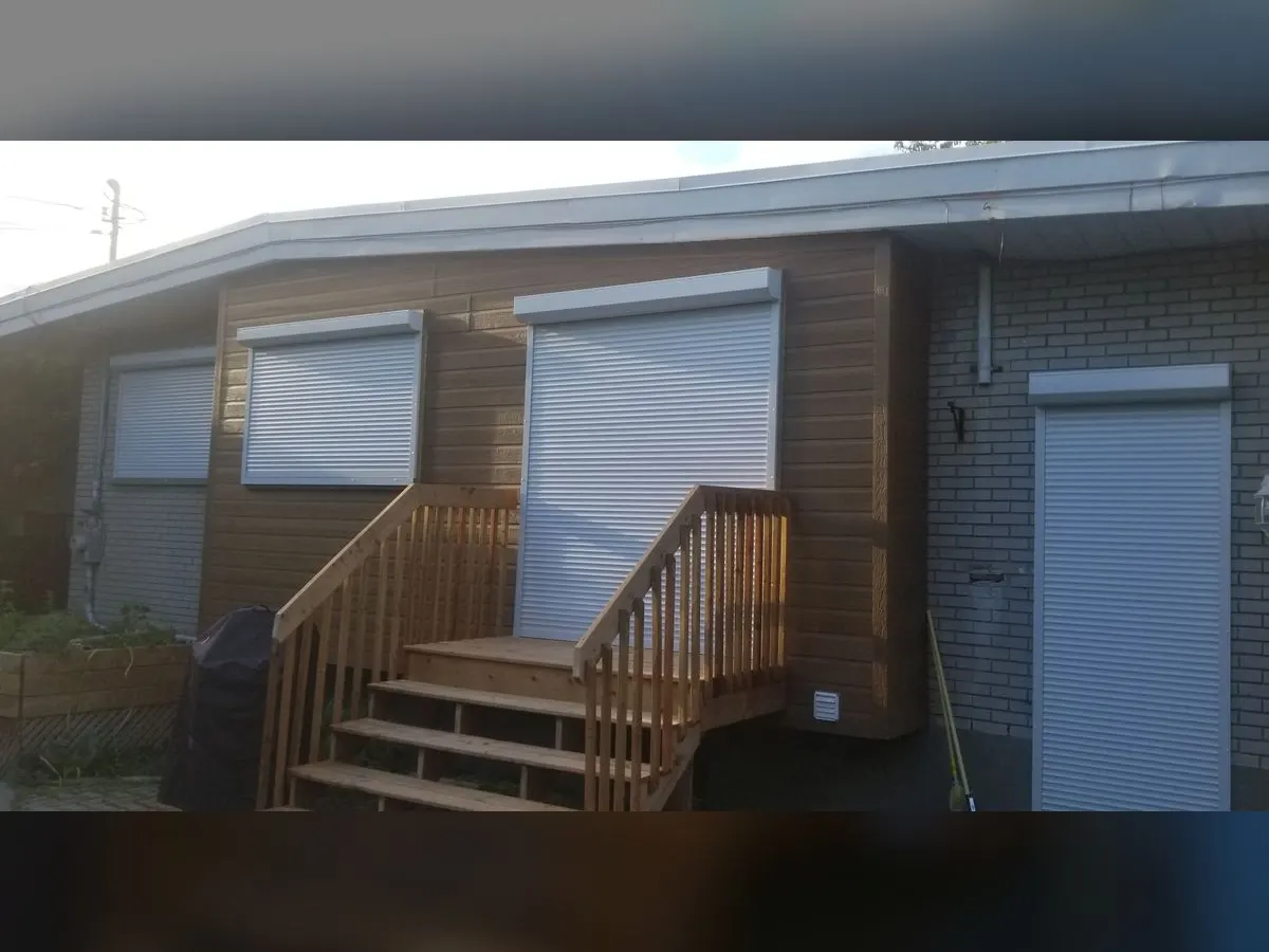 White shutters on the back windows and door