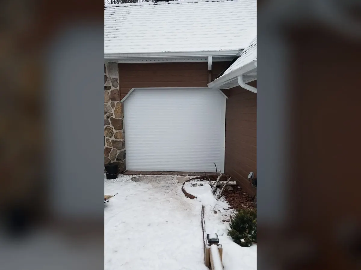 White roll-up garage door in winter