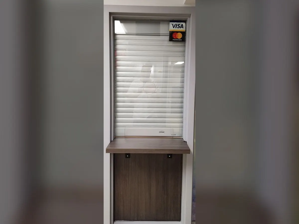 Service wicket closed by a shutter