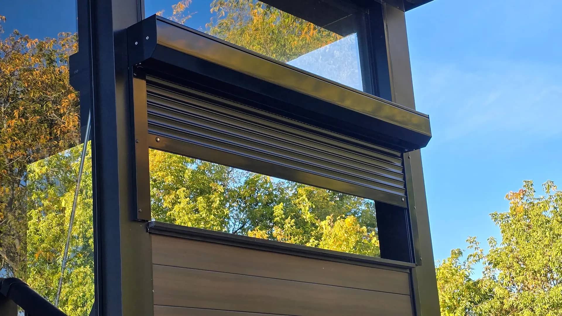 Black shutter on a modern balcony