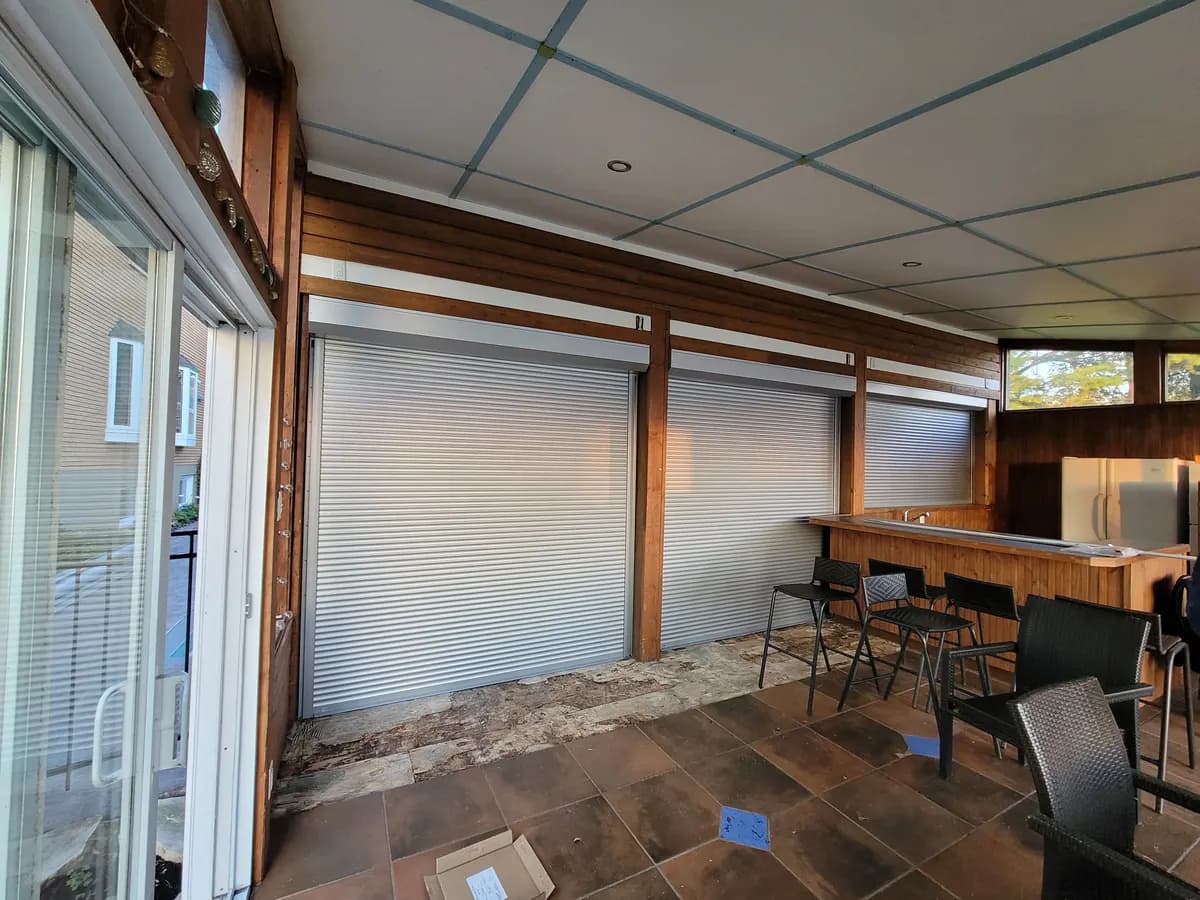 Covered terrace closed by white shutters